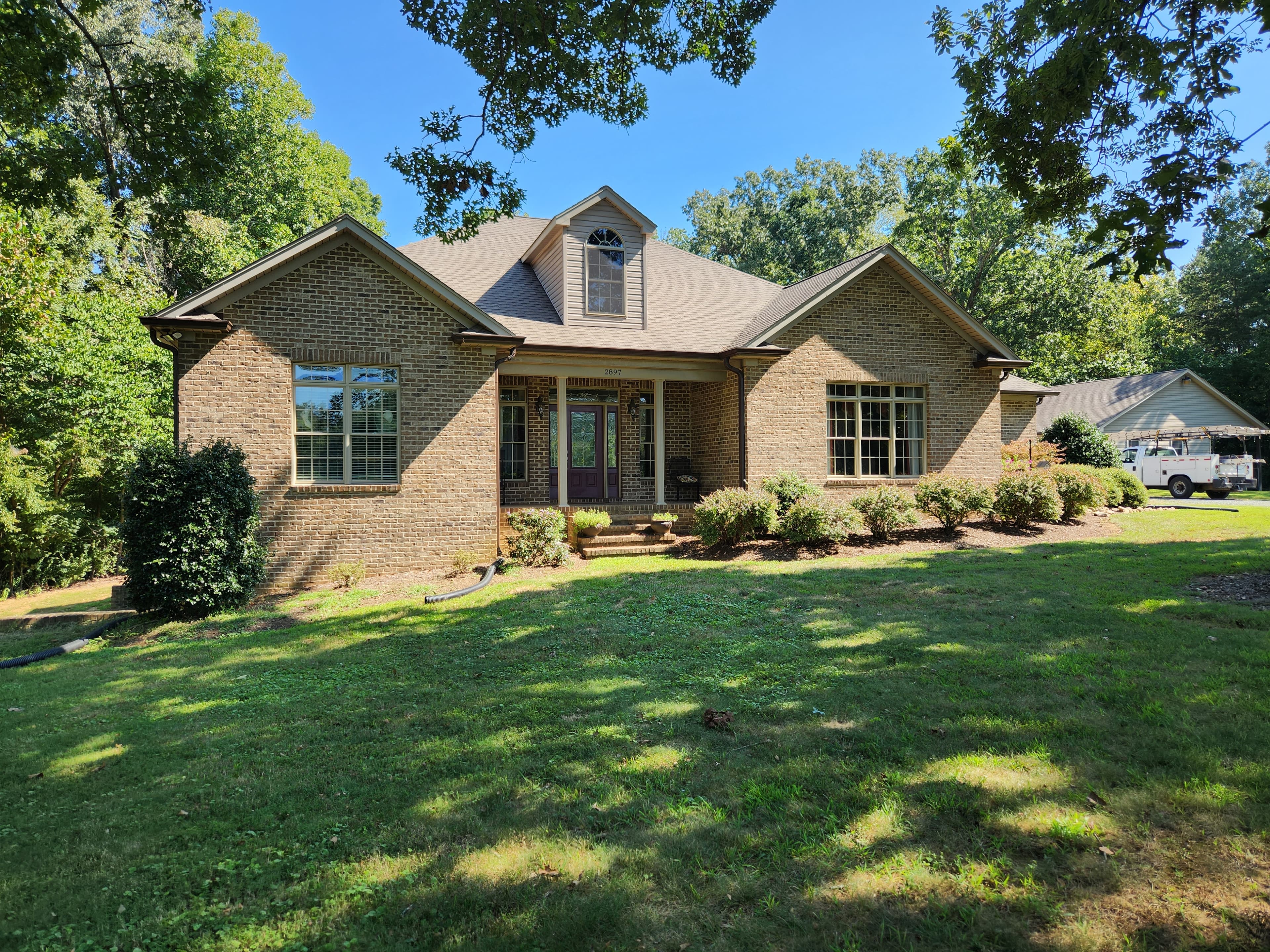 Seamless gutters on a brick craftsman home near Saxapahaw, NC