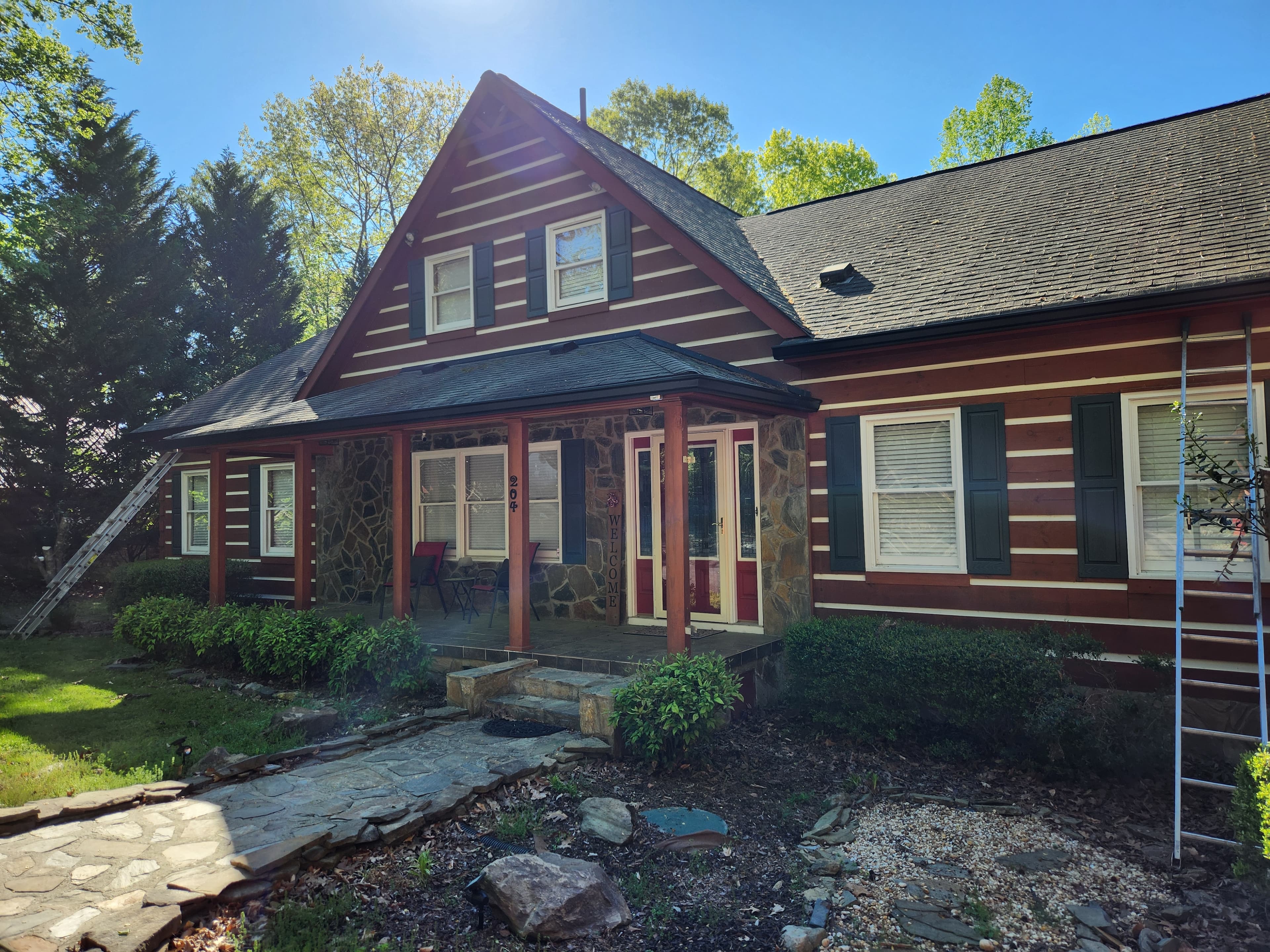 Custom seamless gutter installation on a log home, rural NC