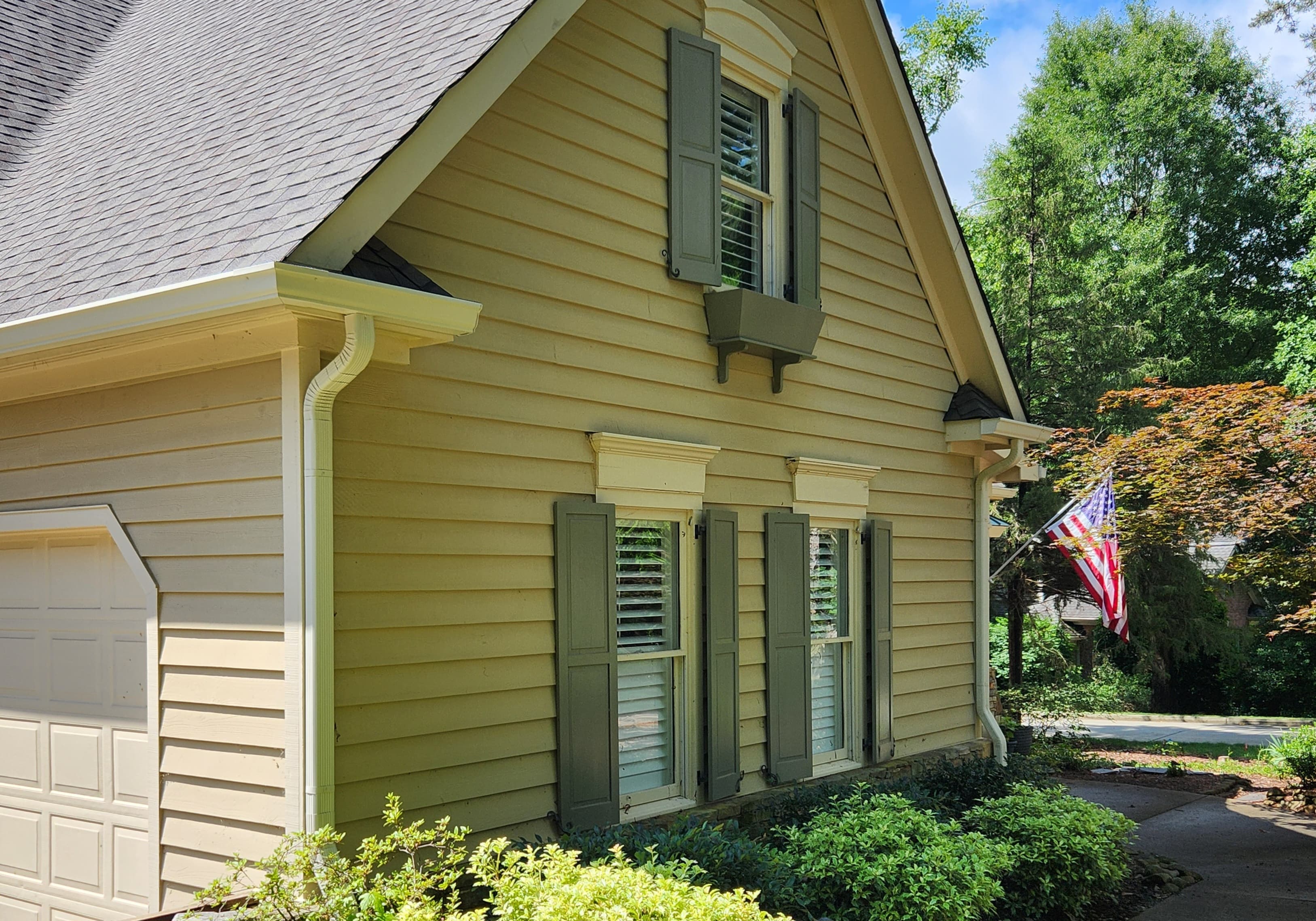 Well-maintained home exterior with clean gutters ready for listing in Mebane NC
