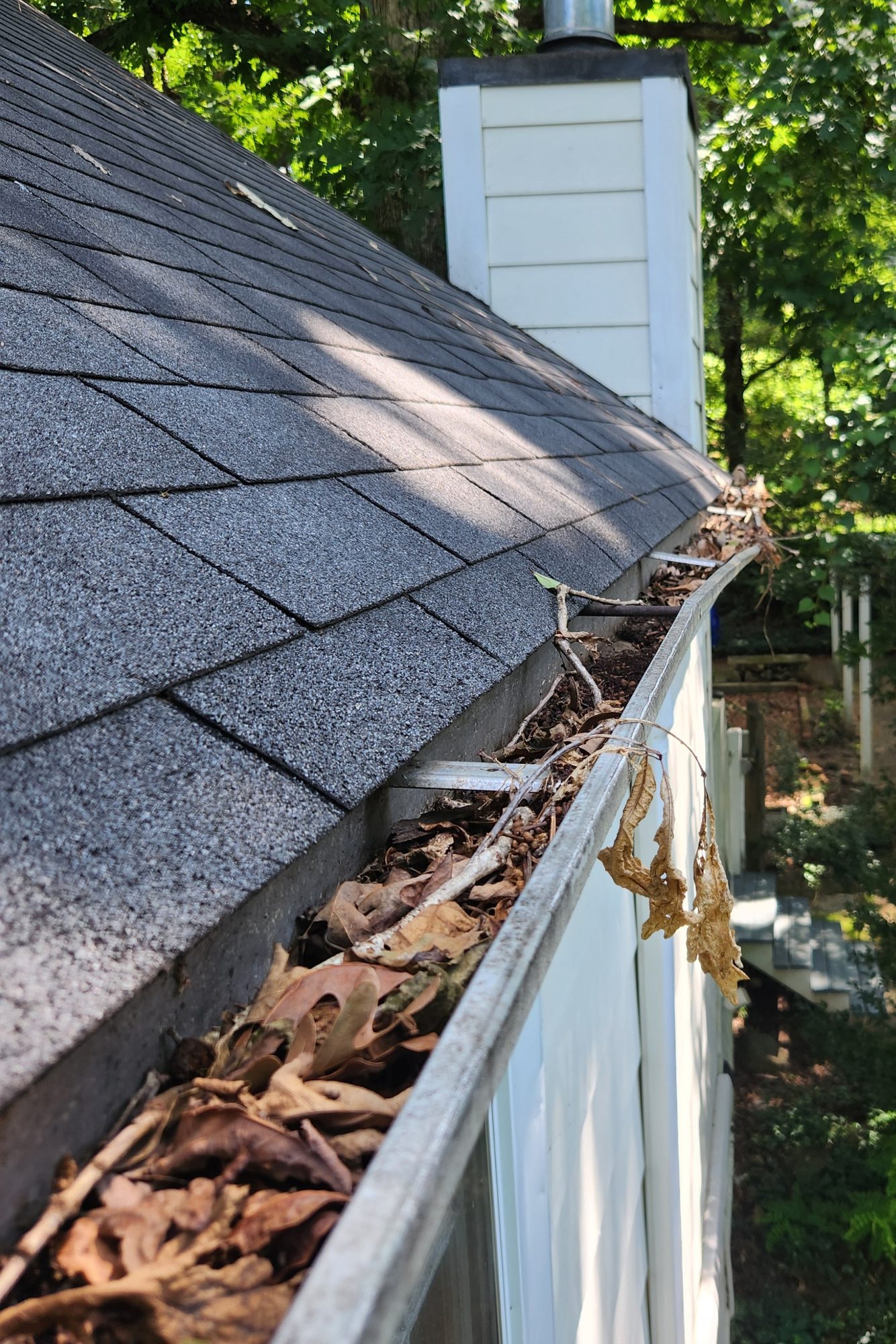 Gutter clogged with leaves and debris on an Alamance County NC home before listing, the kind of issue flagged on home inspection reports