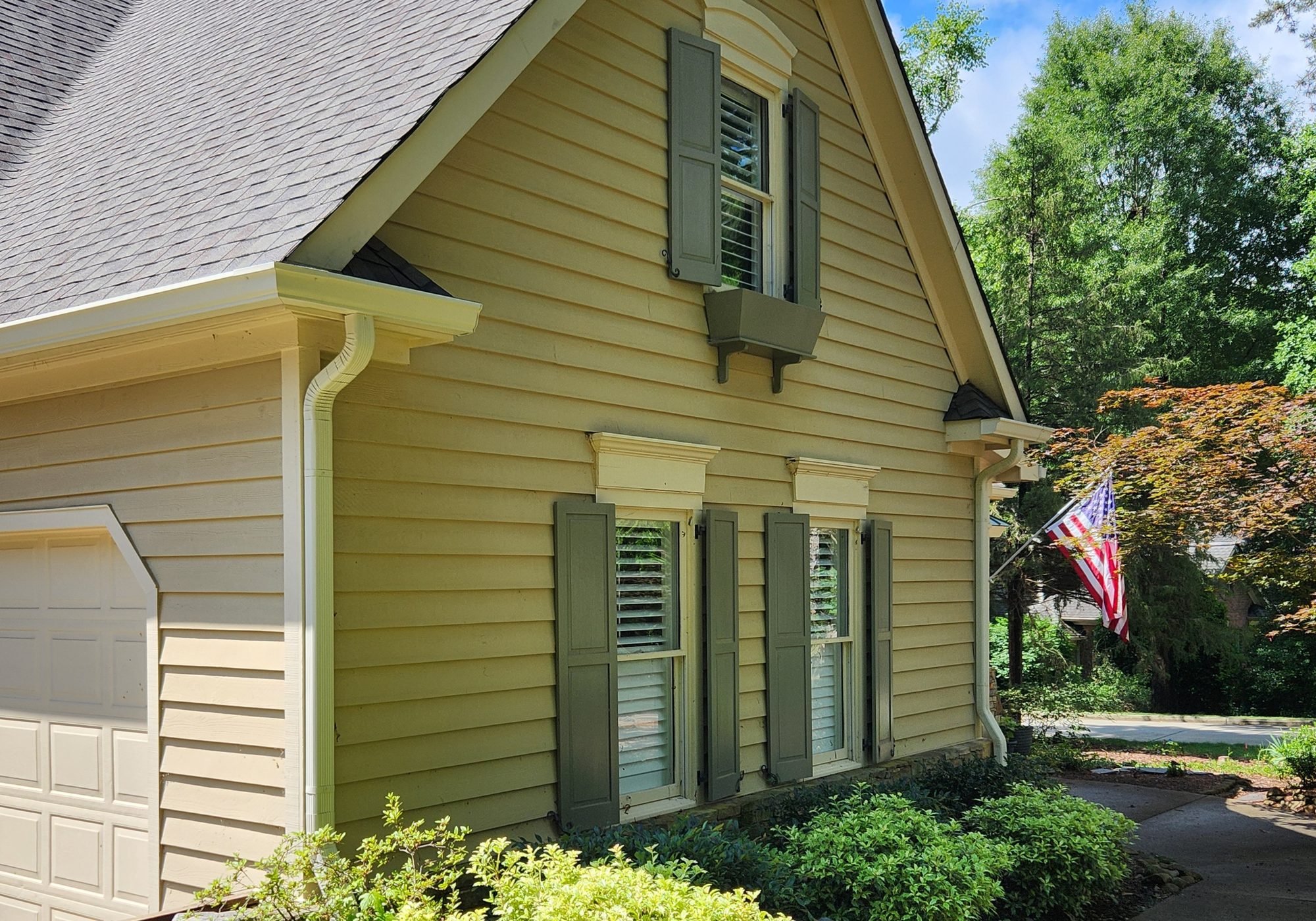 Well-maintained home exterior with clean gutters ready for listing in Mebane NC